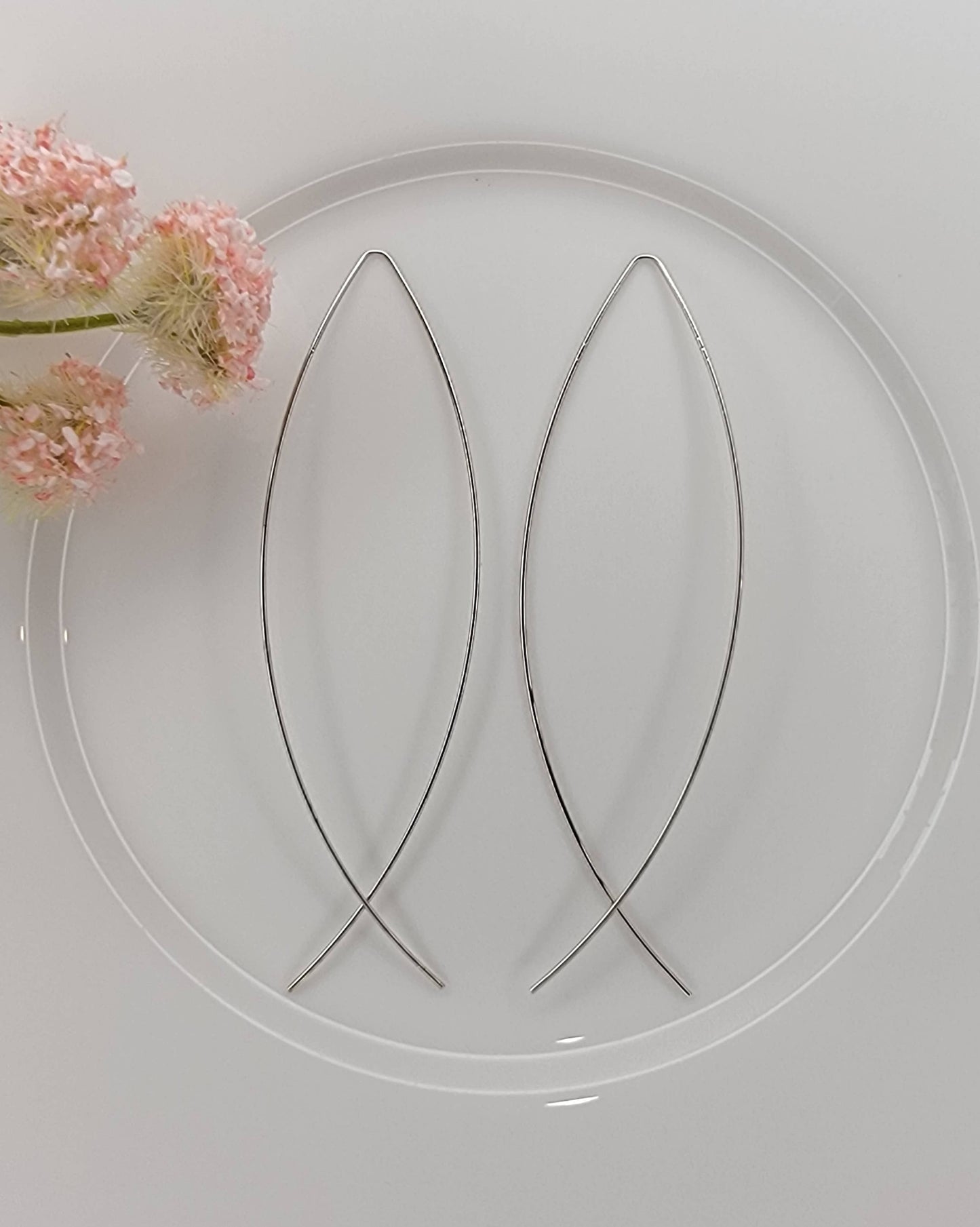 FISH SHAPED LONG WIRE HOOP EARRINGS.